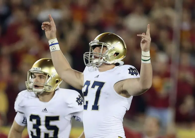 No. 1 Notre Dame beat USC, books national title game slot