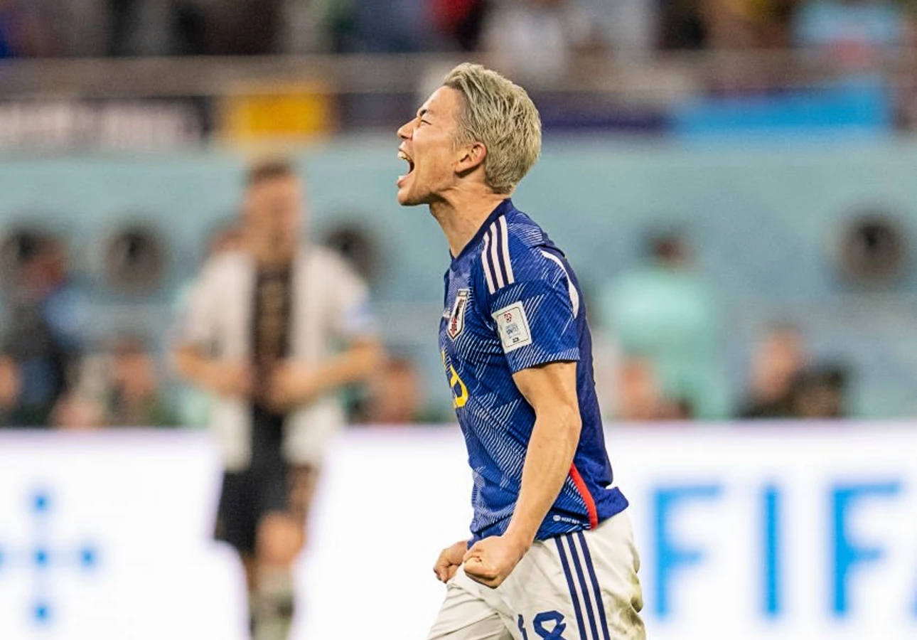 Takuma Asano of Japan celebrates against Germany