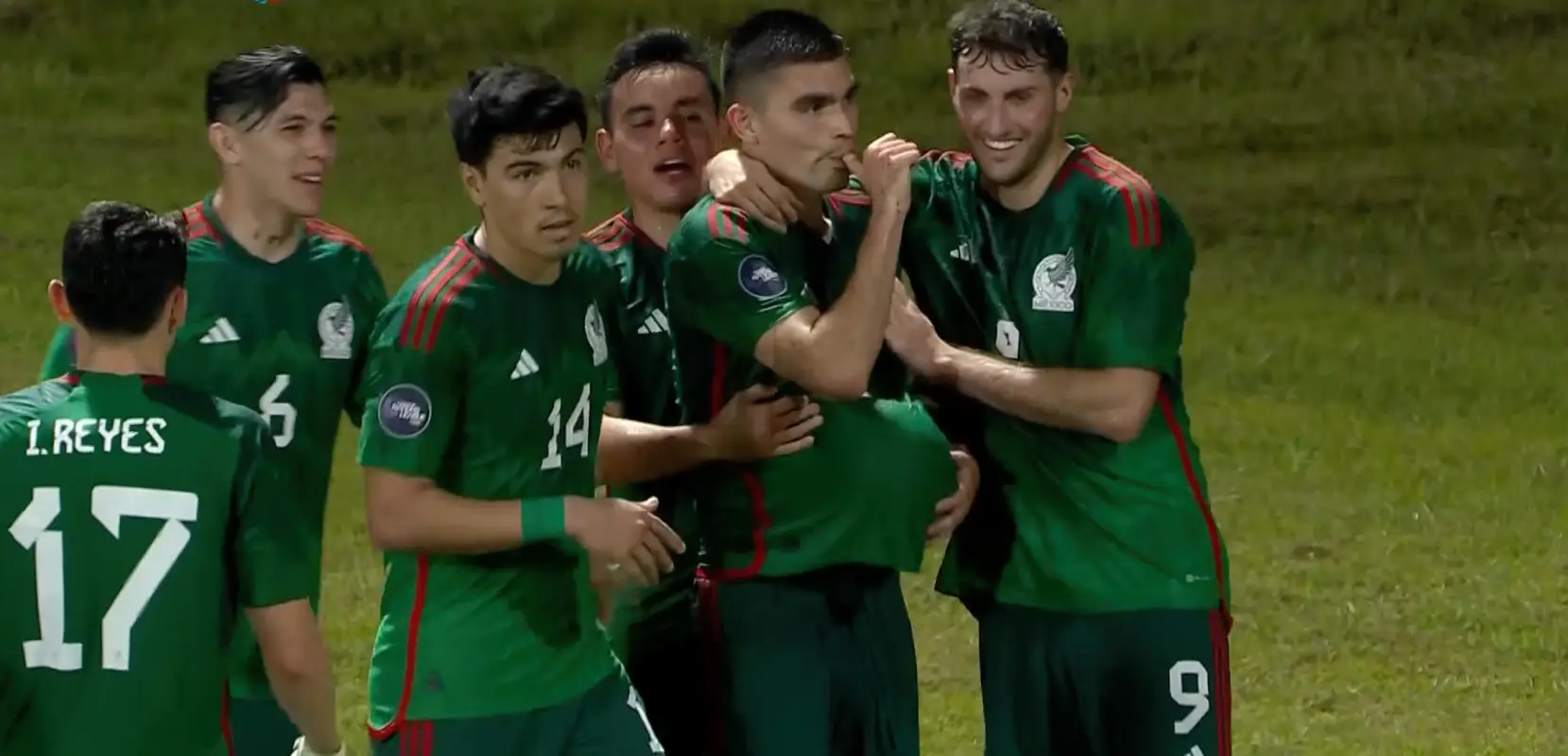 Mexican players celebrate after scoring a goal in the Nations League match