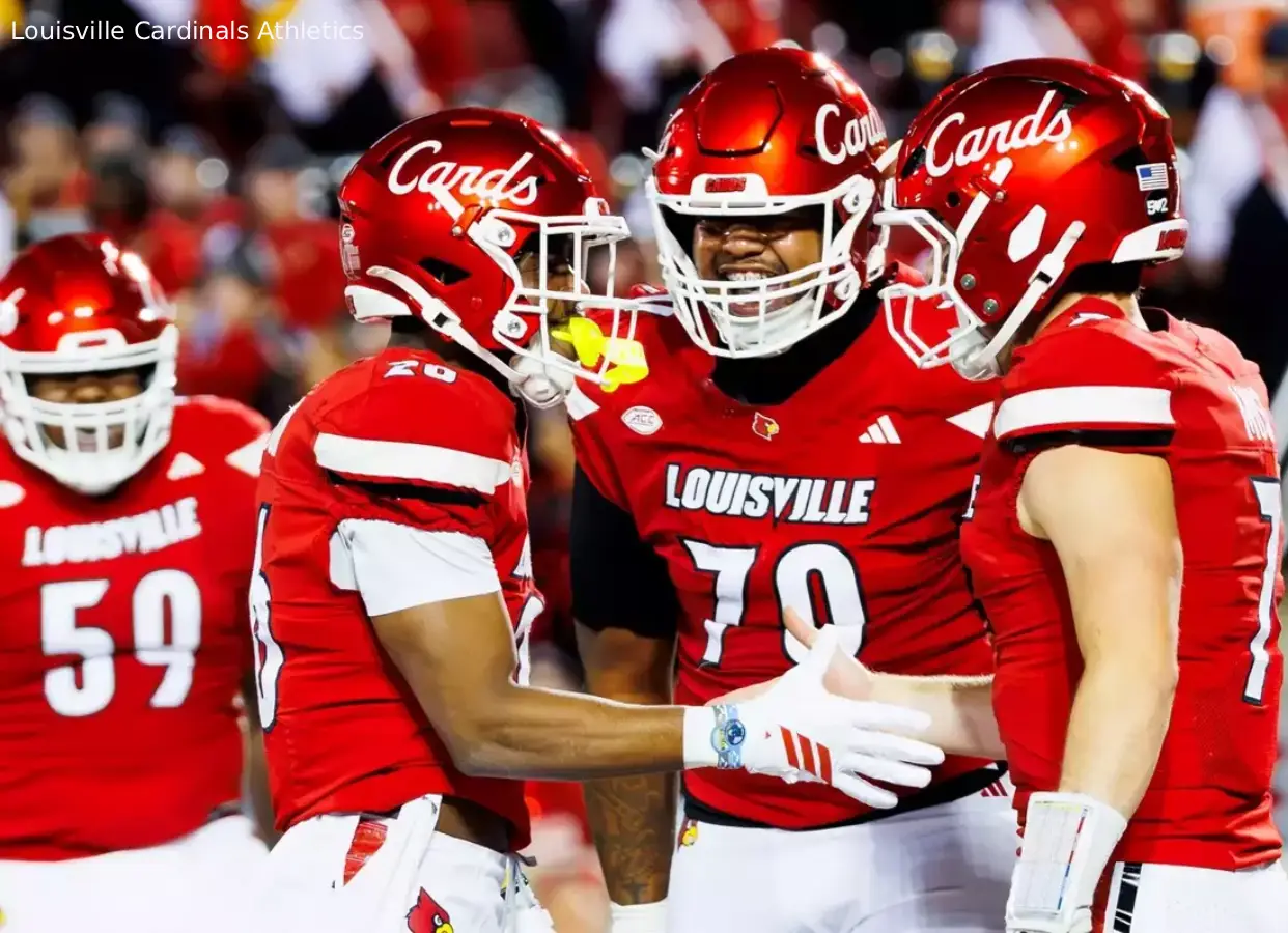 Louisville Cardinals players reacted during a college football game.